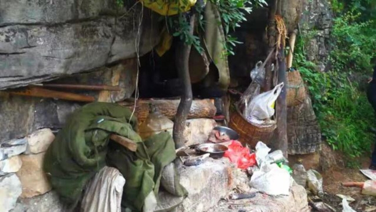 The cave was surrounded by pots and garbage. Picture: WeChat/Yongshan Police