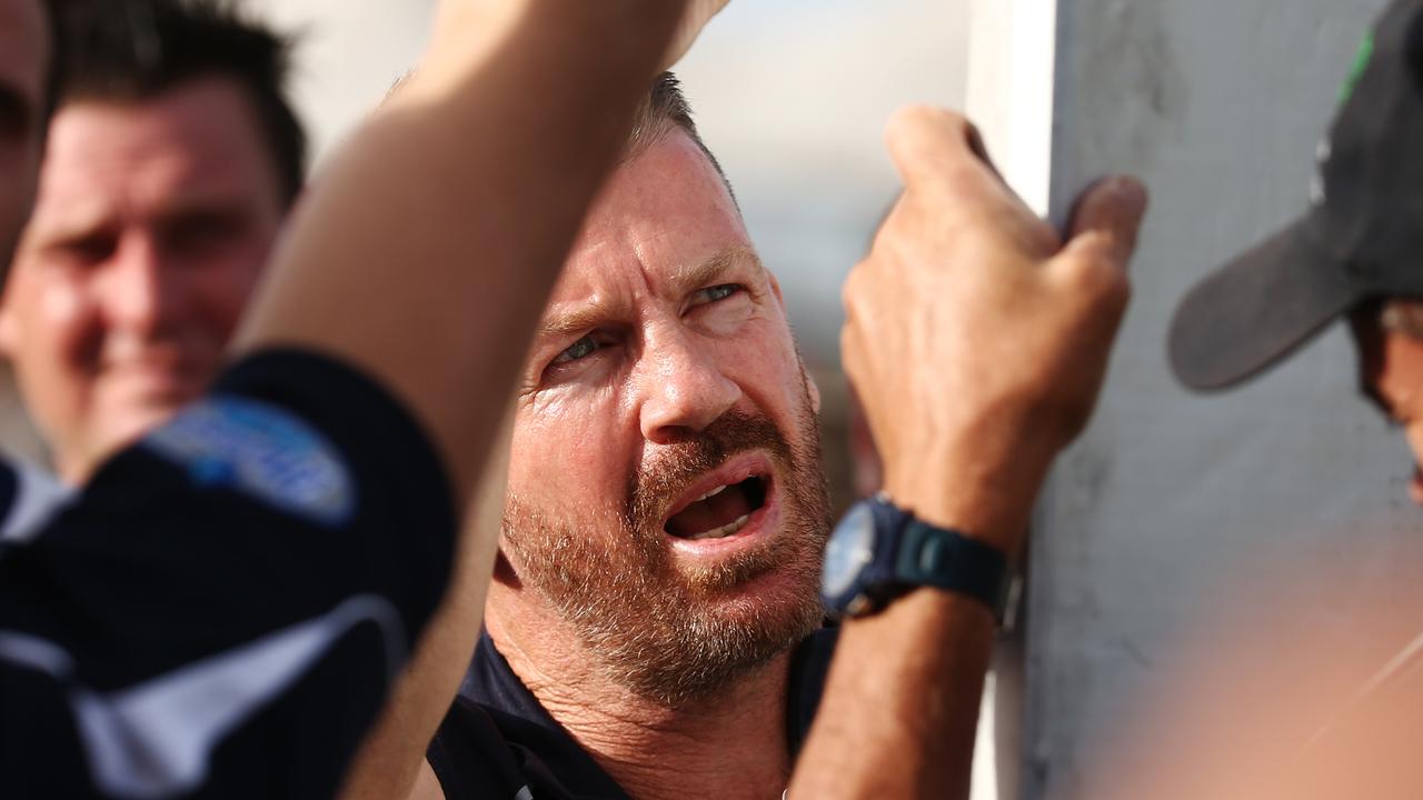 Port Douglas coach Brad Cooper rallies his players at three quarter time in the AFL Cairns men's grand final match between the Port Douglas Crocs and the South Cairns Cutters, played at Cazalys Stadium. PICTURE: BRENDAN RADKE