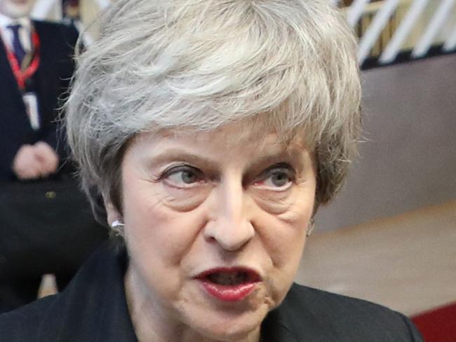 British prime minister Theresa May speaks to medias as she arrives on December 13, 2018 in Brussels for a European Summit aimed at discussing the Brexit deal, the long-term budget and the single market. - The 27 European leaders gather for a crucial European Union summit with the British Prime Minister seeking a compromise to save the Brexit deal. (Photo by Ludovic MARIN / AFP)