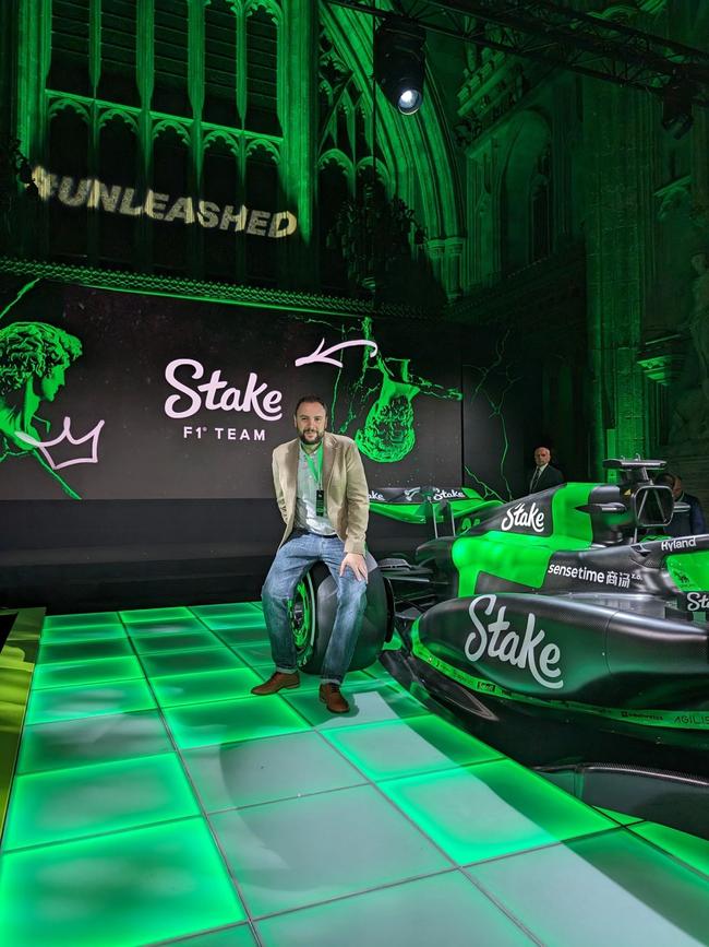 Brais Pena Sanchez, chief strategy officer at EasyGo, the parent company of online casino Stake.com, with the company's Formula 1 team car. Picture: LinkedIn.