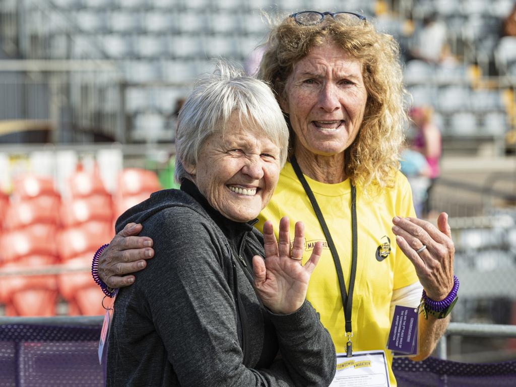 Carol Parkinson (left), with Margaret Moloney, reacts as her daughter Kathryn Parkinson is the first female to finish the Toowoomba Marathon, Sunday, May 5, 2024. Picture: Kevin Farmer