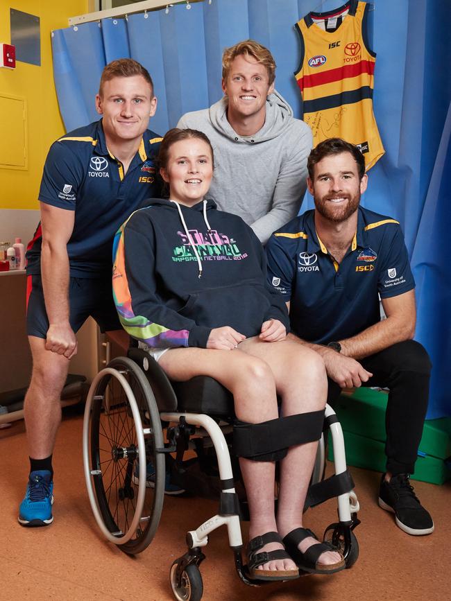 Crows players Rory Laird, Rory Sloane and Andy Otten visit Katelin Gunn in hospital in May, 2019. Picture: MATT LOXTON