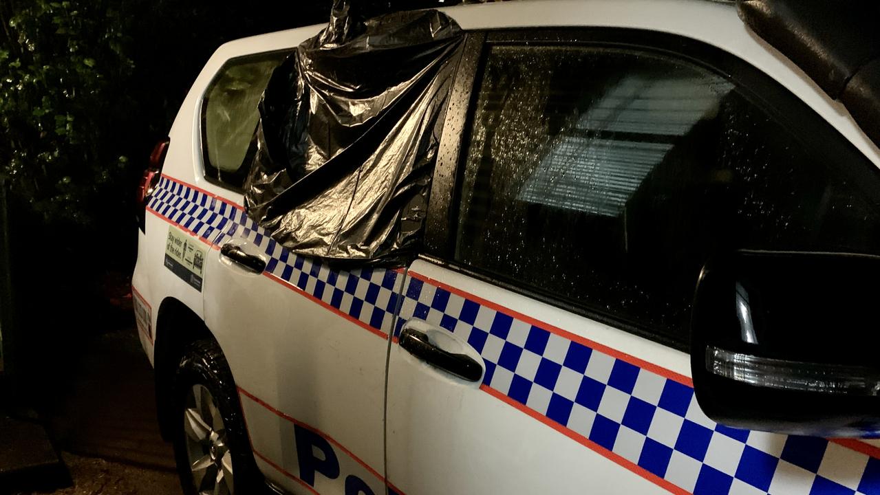 A police vehicle was allegedly damaged when the man was taken into police custody following the death of a woman at Finch Hatton. Picture: Rae Wilson and Tara Miko