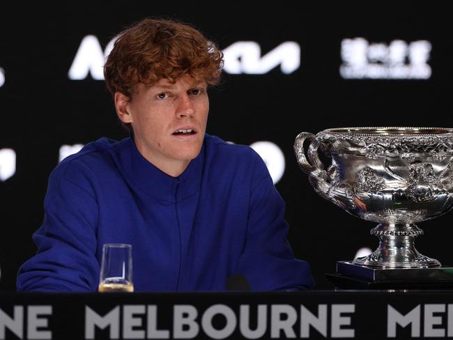 Italy's Jannik Sinner speaks during a press conference after his victory against Germany's Alexander Zverev during their men's singles final match on day fifteen of the Australian Open tennis tournament in Melbourne on January 27, 2025. (Photo by Adrian Dennis / AFP) / -- IMAGE RESTRICTED TO EDITORIAL USE - STRICTLY NO COMMERCIAL USE --