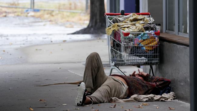 A rough sleeper gets some rest on the street in Coffs. Picture: Toby Zerna