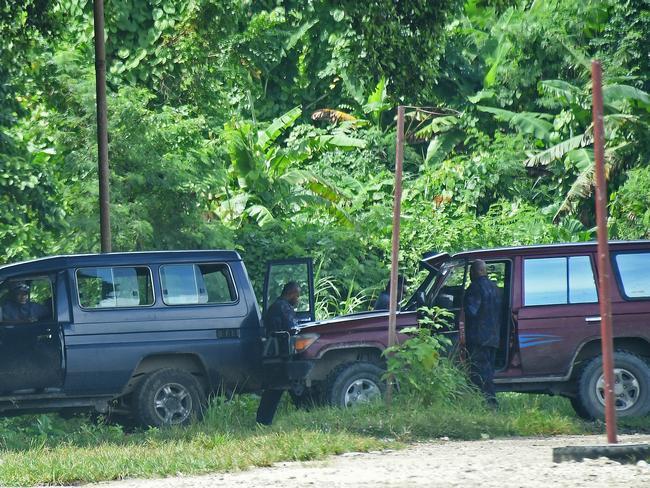 Members of PNG's paramilitary force wait just outside Lorengau. Picture: Brian Cassey