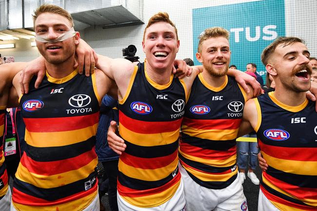 Adelaide Crows players Daniel Talia, Tom Lynch, Hugh Greewood and Jordan Galluccio sing the club song after beating Port Adelaide Power in Showdown 46. Picture: Daniel Kalisz/Getty