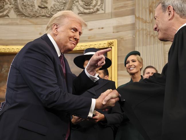 President Donald Trump gestures to Supreme Court Chief Justice John Roberts after being sworn in as president during the 60th Presidential Inauguration in the Rotunda of the U.S. Capitol in Washington, Monday, Jan. 20, 2025. (Chip Somodevilla/Pool Photo via AP)