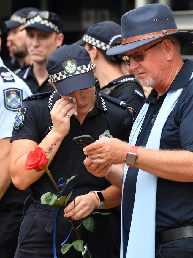 Memorial police service for Constable Matthew Arnold and Constable Rachel McCrow at Townsville Police Station. Consable Bree Lochyear, who went through Police Academy with Rachel, and Police Chaplain Glenn Louttit. Picture: Evan Morgan