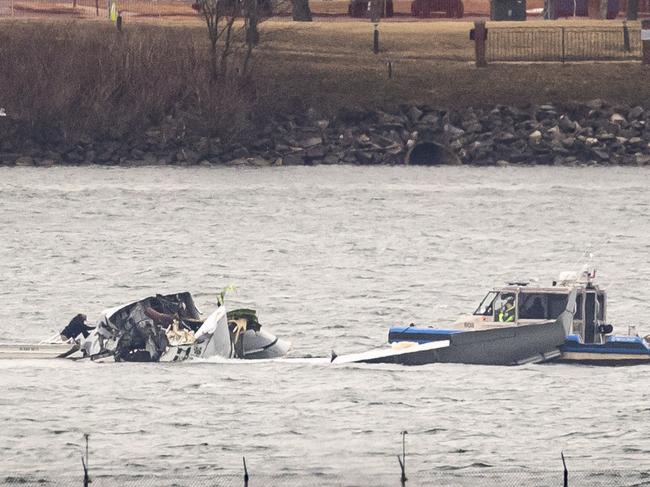 Recovery teams search the wreckage after the crash of an American Airlines plane on the Potomac River. Picture: Al Drago/Getty Images/AFP