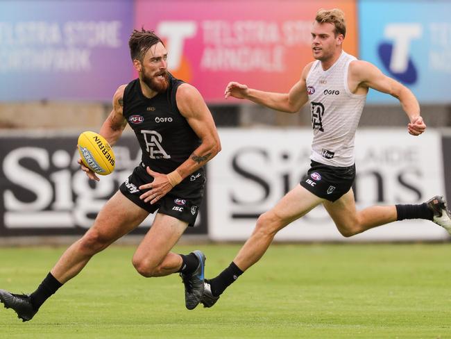 ADELAIDE, AUSTRALIA - FEBRUARY 14: Charlie Dixon being chased by \\Jack Watts during the Port Adelaide Power Intra-Club match at Alberton Oval on February 14, 2020 in Adelaide, Australia. (Photo by Matt Turner/AFL Photos via Getty Images)