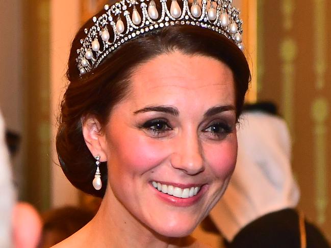 LONDON, ENGLAND - DECEMBER 04:   Catherine, Duchess of Cambridge greets guests at an evening reception for members of the Diplomatic Corps at Buckingham Palace on December 04, 2018 in London, England. Approximately 7,500 military personnel are currently serving overseas at Christmas.  (Photo by Victoria Jones - WPA Pool/Getty Images)