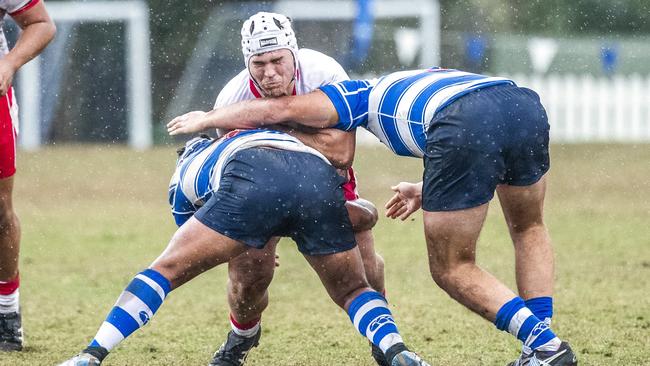 Ben Murphy hit by typical Nudgee defence.Picture: Richard Walker