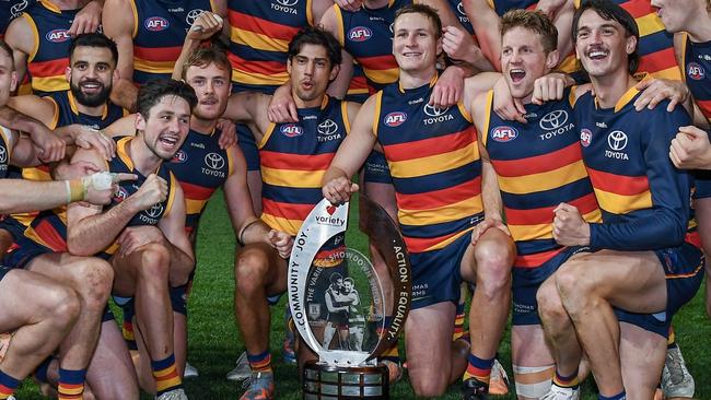 ADELAIDE, AUSTRALIA - JULY 29: The Crows pose with the Variety Showdown Shield after winning the round 20 AFL match between Adelaide Crows and Port Adelaide Power at Adelaide Oval, on July 29, 2023, in Adelaide, Australia. (Photo by Mark Brake/Getty Images)