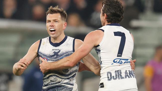 Shaun Higgins (left), with Isaac Smith, celebrates a goal as the small forward returned to form with a solid game. Picture: AFL Photos via Getty Images