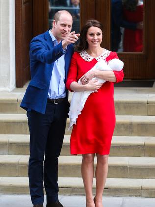 The happy couple show off their newborn boy.