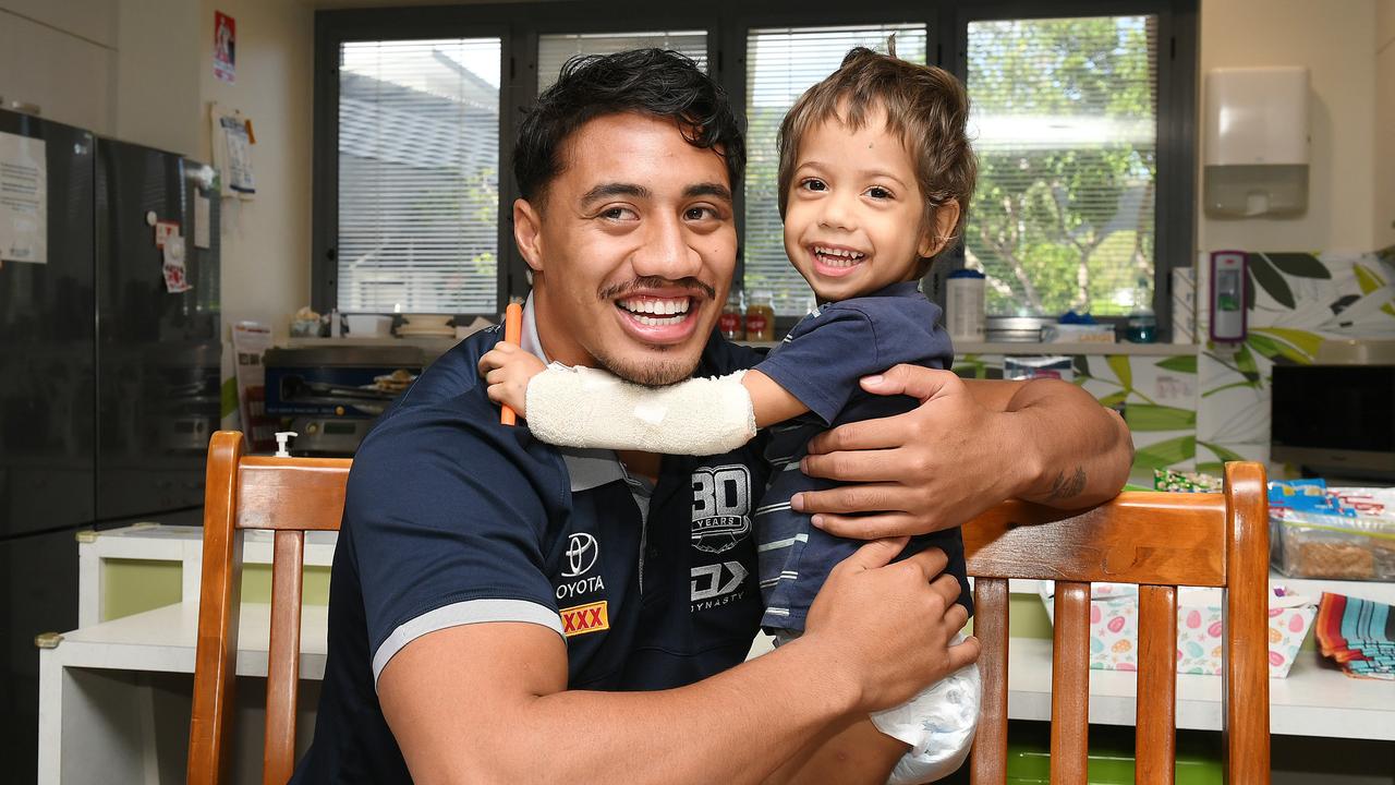 Cowboy Murray Taulagi spreads some joy to young patient Isacc Geia, 3, at Townsville University Hospital as part of a special visit in collaboration with Ronald McDonald House Charities. Picture: Shae Beplate.