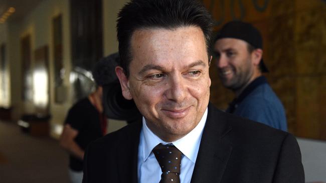 Independent Senator Nick Xenophon leaves after speaking at a press conference at Parliament House in Canberra on Thursday, April 21, 2016. (AAP Image/Mick Tsikas) NO ARCHIVING