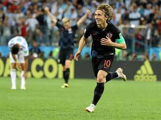 Why neutral fans should cheer for Croatia not France. Croatia's captain Luka Modric celebrates making Sunday's final.