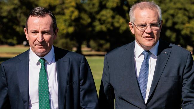 WA Premier Mark McGowan (left) and Prime Minister Scott Morrison are seen arriving for a press conference in Perth, Thursday, March 17, 2022.  (AAP Image/Richard Wainwright) NO ARCHIVING