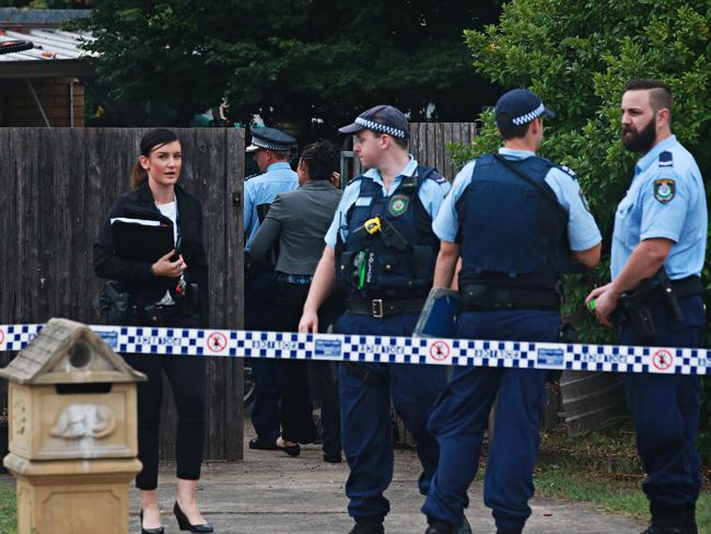 Police investigators at the scene in Macquarie Fields. Picture: Adam Yip