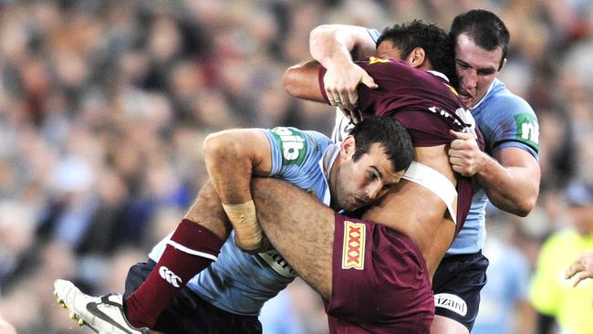 Anthony Laffranchi (left) puts his shoulder into a Maroons player as he leads the tackle count on his Origin debut.