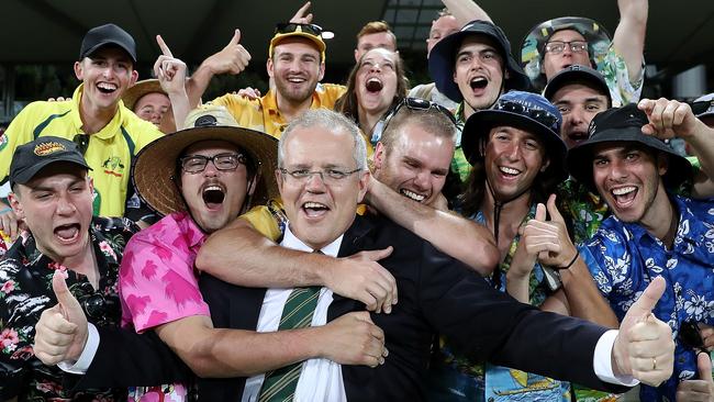 PM Scott Morrison is mobbed by the crowd after after the end of the Prime Minister’s XI vs South Africa match. Picture: Kym Smith