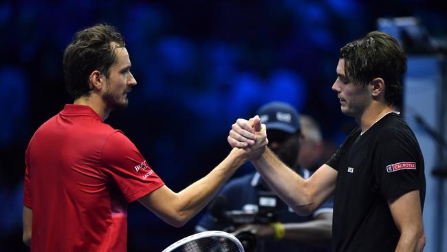 Taylor Fritz of United States shakes hands with Daniil Medvedev following the match. (Photo by Valerio Pennicino/Getty Images)