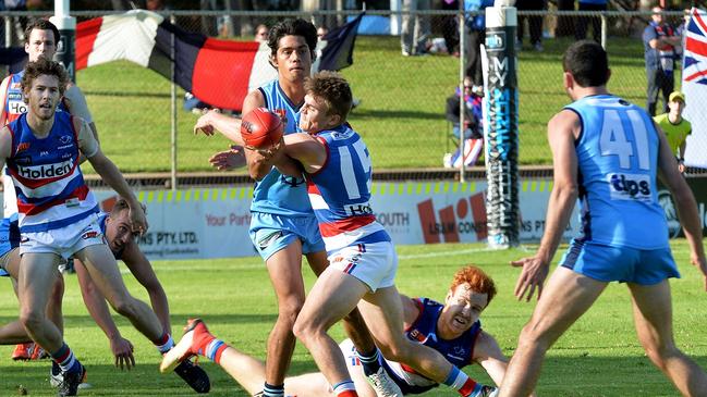 Sturt’s Shane McAdam gets the ball away under pressure against Central. Picture: Dean Martin