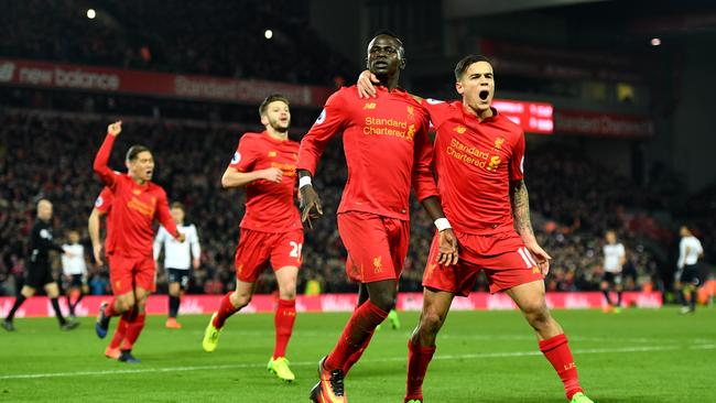 Sadio Mane (2nd R) of Liverpool celebrates scoring.