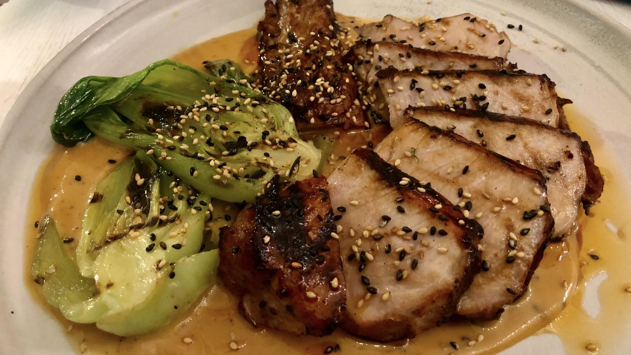 Pork chop, bok choy and miso sauce at Four Sides Bar and Kitchen. Picture: Supplied