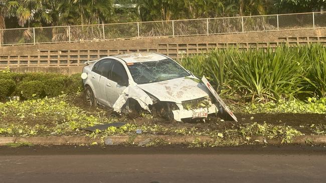 The garden bed of the traffic island was ripped up, surrounded by debris. Picture: Elise Graham.