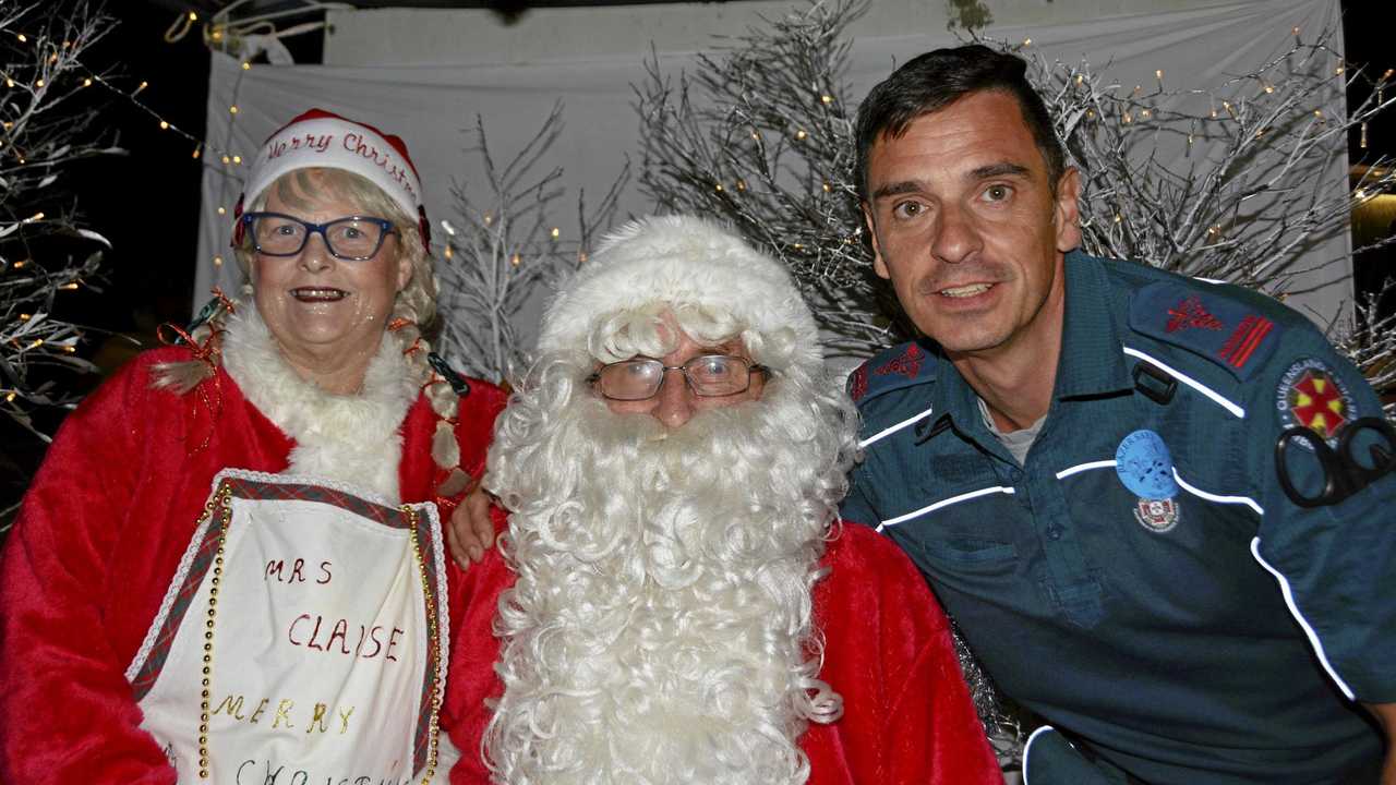 Mr and Mrs Santa Claus with local paramedic David Hornsby at the Tara Christmas Carnival. Picture: Eloise Quinlivan