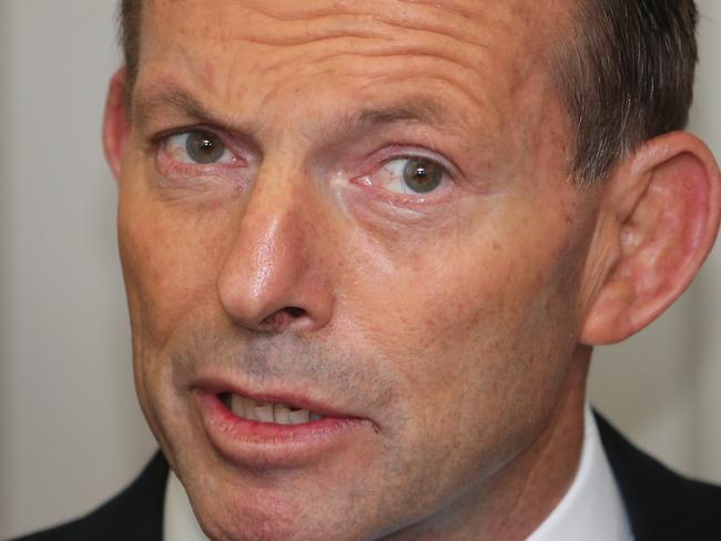 GEELONG, AUSTRALIA - APRIL 30: Australian Prime Minister Tony Abbott speaks as he visits Backwell IXL on April 30, 2014 in Geelong, Australia. Prime Minister Abbott today confirmed he will scale back his paid parental leave scheme cutting the benefit by 25% to help deal with what he referred to as the 'budget crisis'. (Photo by Scott Barbour/Getty Images)