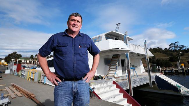 For Sun Tas. World Heritage Cruises operator Troy Grining at the Domain slip yards with the boat he is hoping to operate in the South-West.