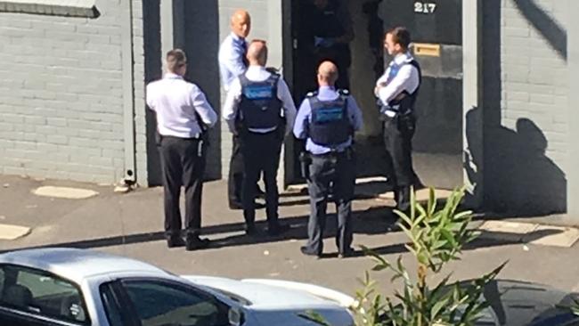 Police outside Mark Thompson’s front door. Picture: Supplied