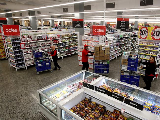 Coles supermarket is opening a new store at Ed.Square in Edmondson Park in Sydney's south west. Employees L-R Zinat Rehana, Jyoti Rayamajhi and Binita Pradhan stock the shelves ready for opening. Picture: Toby Zerna