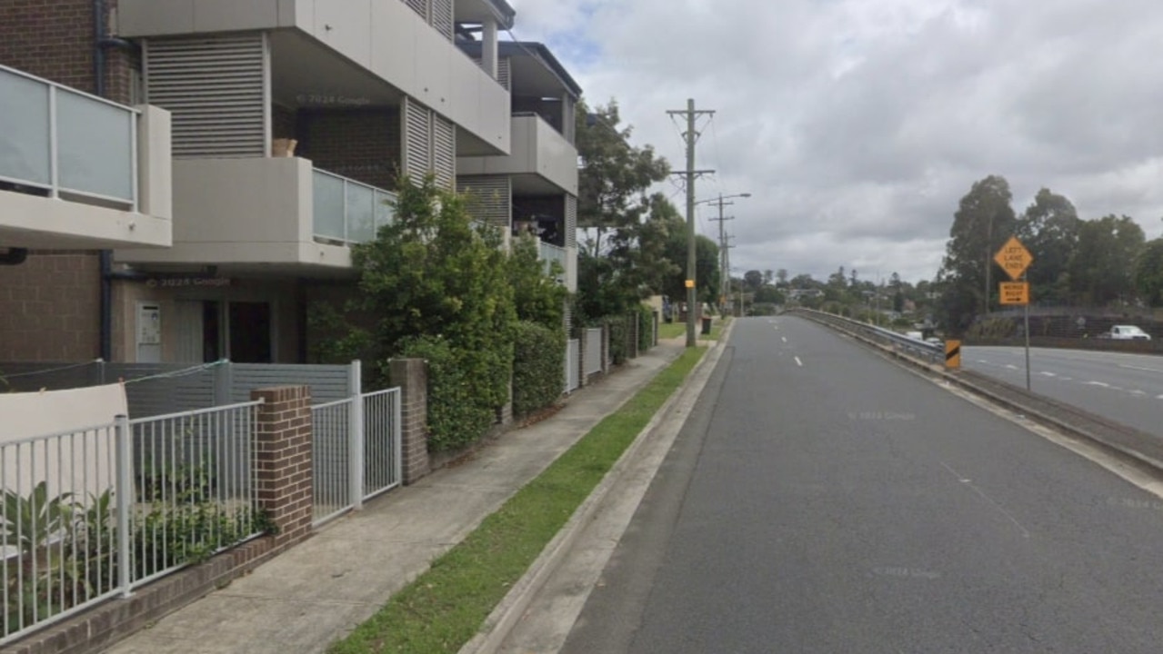 A woman has died after falling from a second-story balcony.