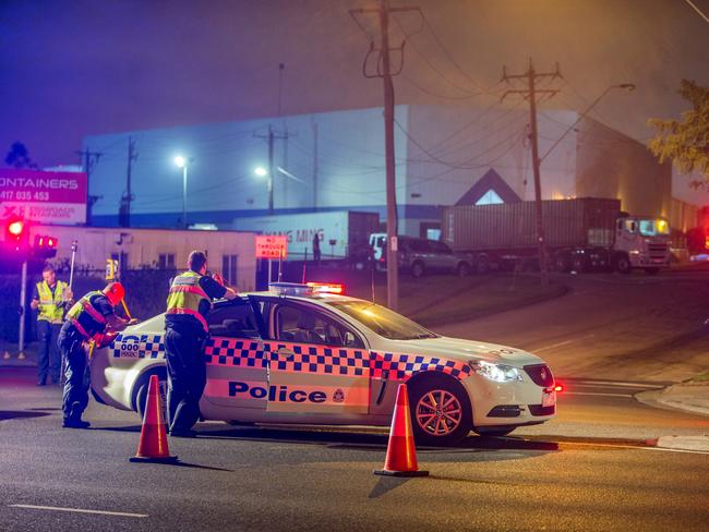 Police at the scene of the fatal crash. Photo: Gary Sissons