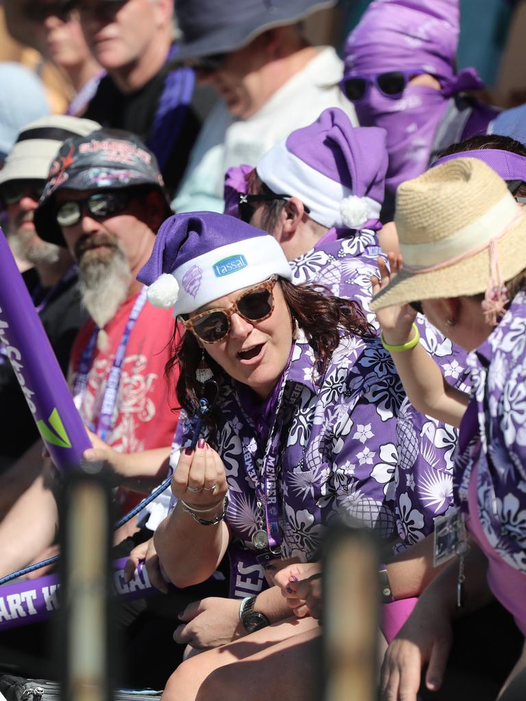 Fans enjoying the hot weather at the Big Bash match between the Hurricanes and Melbourne Stars at Blundstone Arena on Christmas Eve. Picture: LUKE BOWDEN