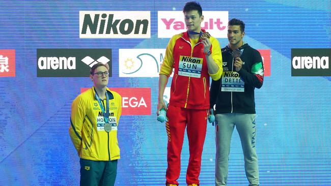 Mack Horton, left, refuses to join gold medallist Sun Yang, centre, on the podium at Gwangju, South Korea, in July last year. Picture: Quinn Rooney/Getty Images