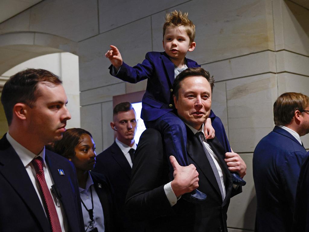 The tech billionaire carries his mini-me son, four-year-old X, on his shoulders as they head into a meeting at the US Capitol. Picture: Getty Images via AFP