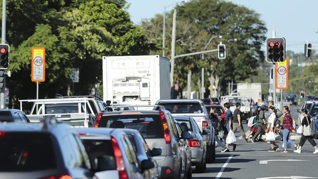 Traffic at pick-up time at Macgregor State School on Brisbane’s southside. PicTURE: Mark Cranitch.