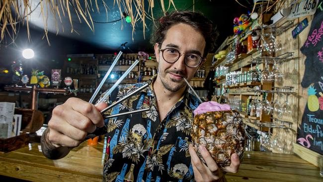 Aloha is one Gold Coast bar ditching plastic straws in an environmental move. Jack Connor with cocktail, Return of the Gidget and the environmentally friendly straws. Picture: Jerad Williams