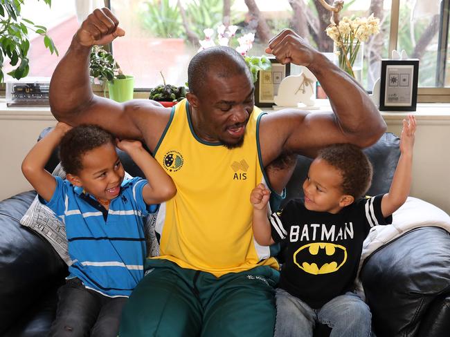 Olympic weightlifter Simplice Ribouem, pictured with sons Nathan, 3, and Samuel, 4, is relying on Centrelink benefits to get himself and his family by as he heads to the Olympics.