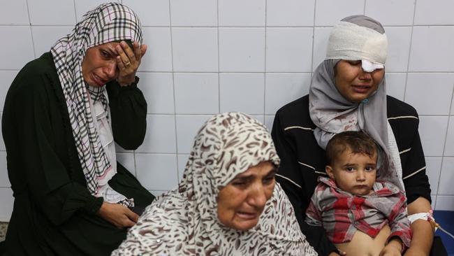 People injured during an Israeli operation in the Jabalia refugee camp waited for treatment at a Gaza City hospital on Monday. Picture: Omar Al-Qattaa/AFP/Getty Images