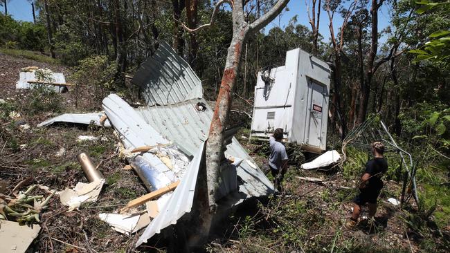 Wongawallan Drive recovers after the Xmas Storms. Residents Jack Walmsley and Clive Du Toit look at wreckage of a communications tower. Picture: Glenn Hampson