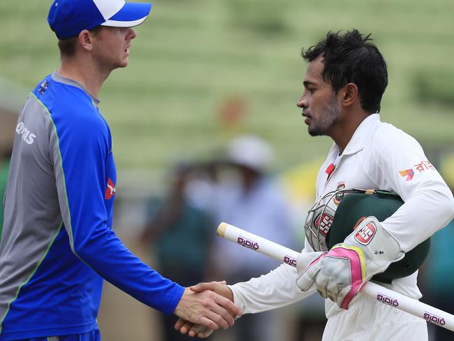 Bangladesh's cricket team captain Mushfiqur Rahim, right, shakes hand with Australian cricket team captain Steve Smith.