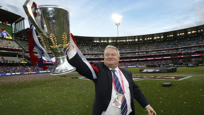 Bulldogs president Peter Gordon holds the cup up high. Picture: David Caird