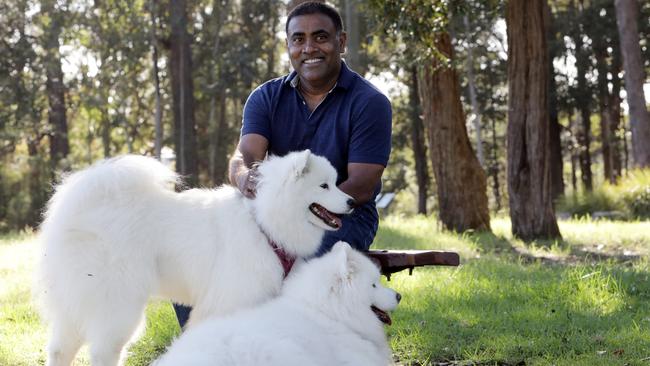 Seelan Nayagam with his two Samoyed dogs, Koda and Lana.